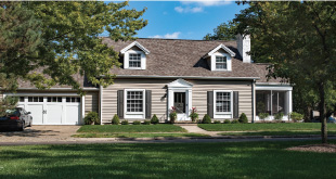 vinyl siding job complete with garage door